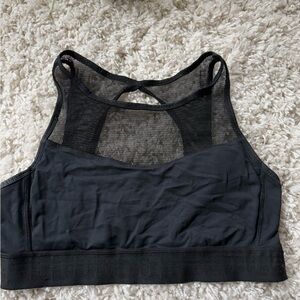 Black sports bra with mesh see-through collarbone neckline. Super cute f…